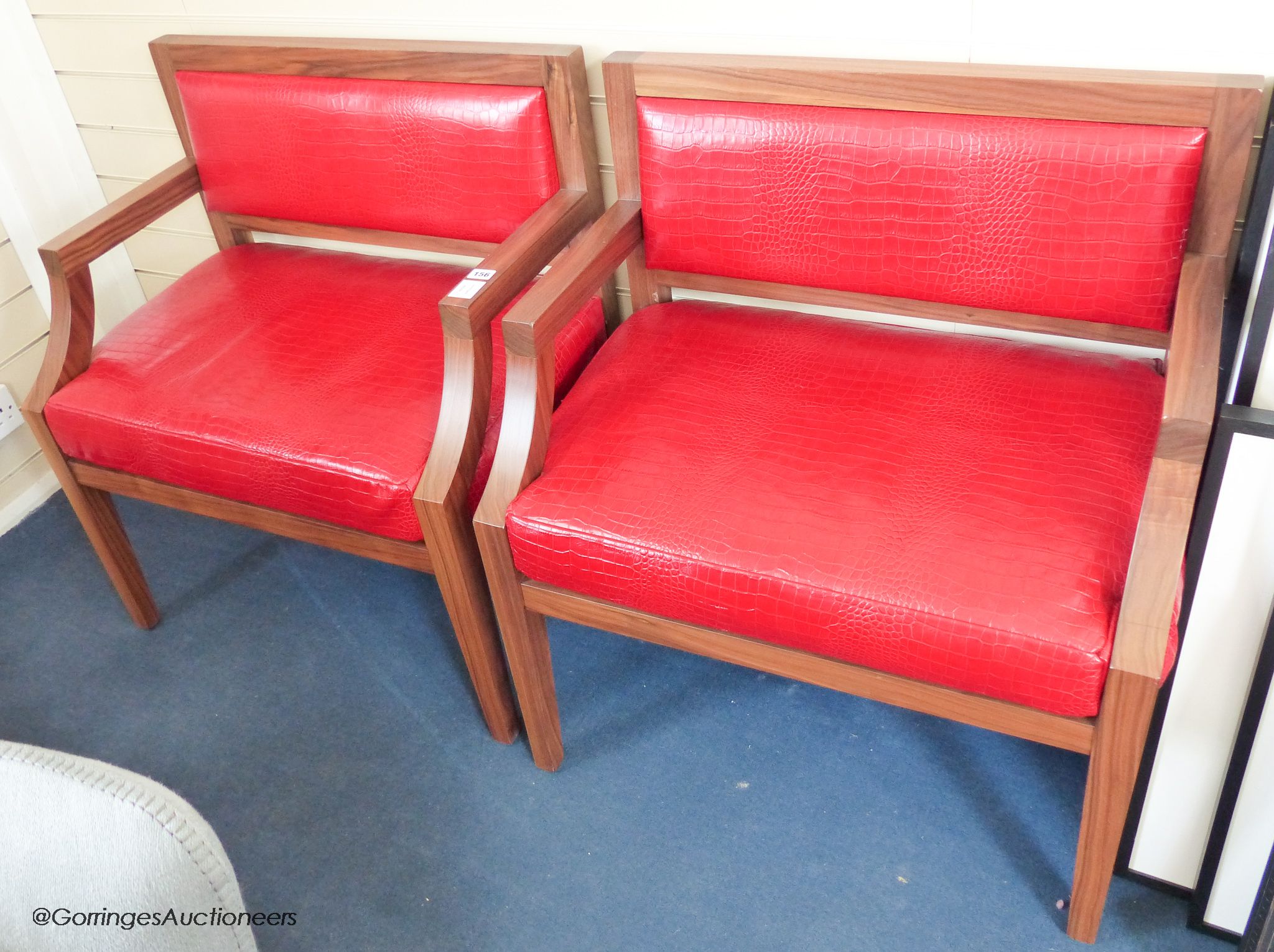 A pair of contemporary walnut and faux crocodile armchairs, 77cm wide